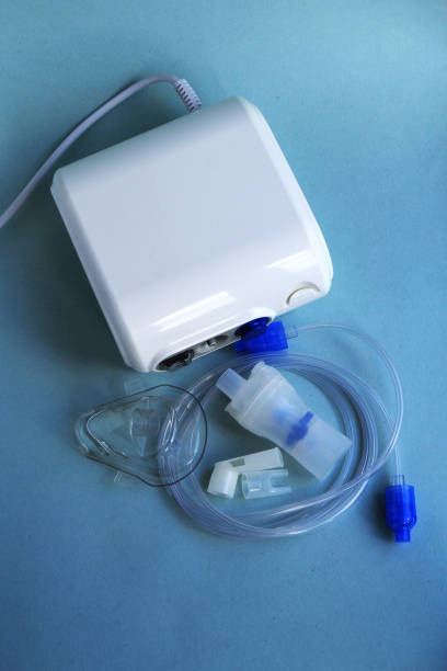 istock Nebulizer medical equipment on blue background. 1281464353