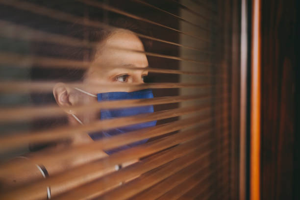 istock Woman wearing prorective face mask during COVID-19 pandemic 1281464507