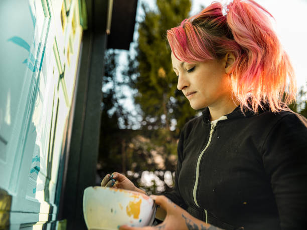 istock Female mural artist at work 1281466001