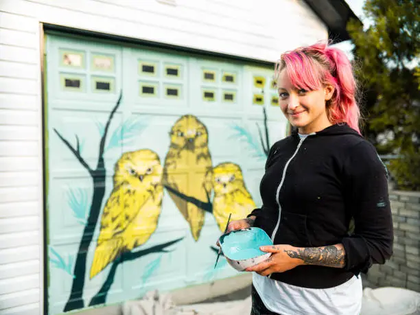 Photo of Female mural artist at work