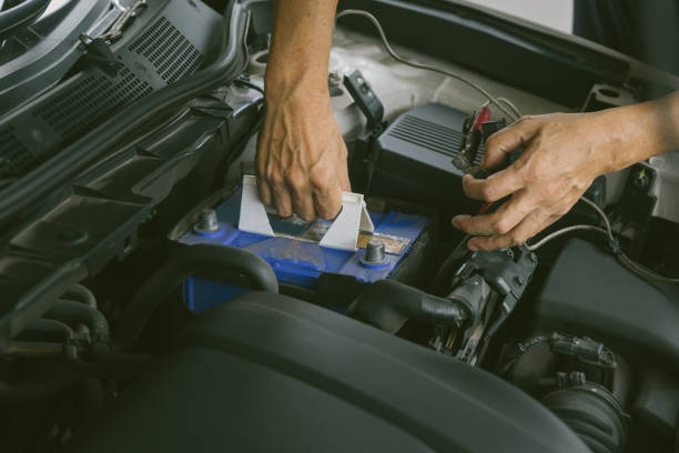 istock Engine engineer is replacing  car battery because car battery is depleted. concept car maintenance And the cost of car care. 1281466031