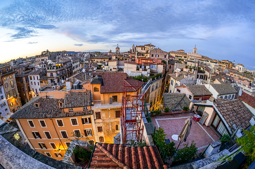 Rome, Italy -- A sunset light view from the rooftops of the iconic roman Pantheon and Piazza della Rotonda quarter, in the heart of Rome. At right the bell tower of the Italian Parliament in Piazza di Montecitorio. Image un High Definition Format.