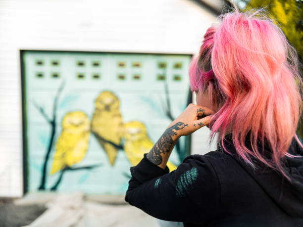 istock Female mural artist at work 1281466065