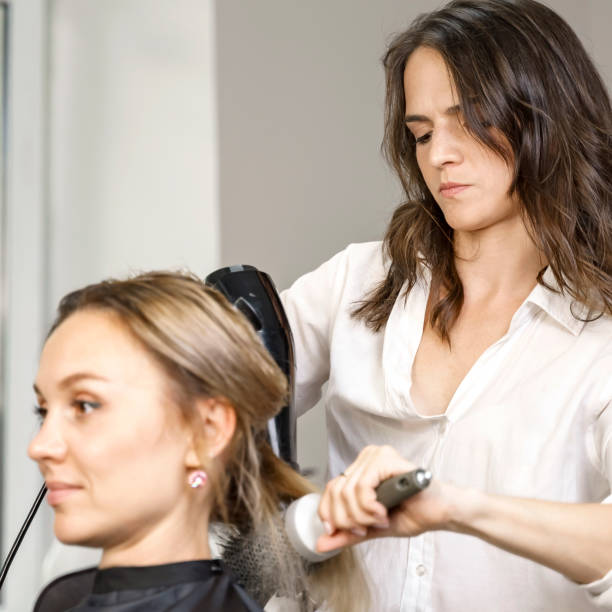 istock hair styling process in a beauty salon 1281466250