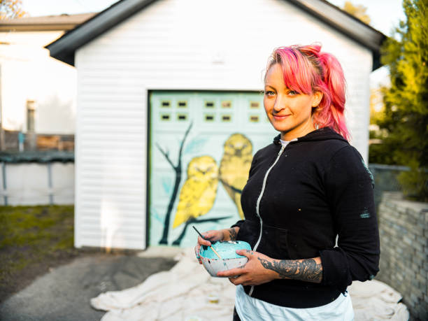 istock Female mural artist at work 1281466303