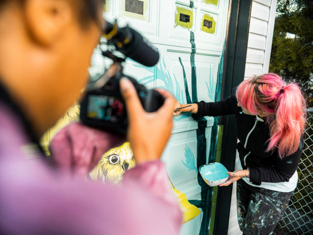 istock Female mural artist at work 1281466444