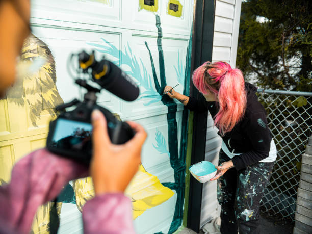 istock Female mural artist at work 1281466447