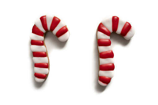 Christmas gingerbread candy cane cookie isolated on white background with shadow