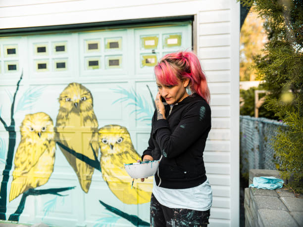 istock Female mural artist at work 1281466578