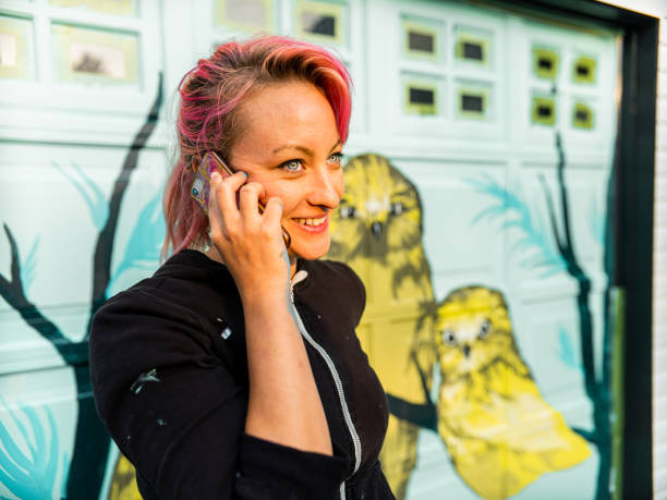 istock Female mural artist at work 1281466581