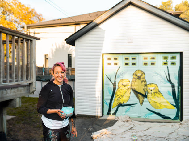 istock Female mural artist at work 1281466587