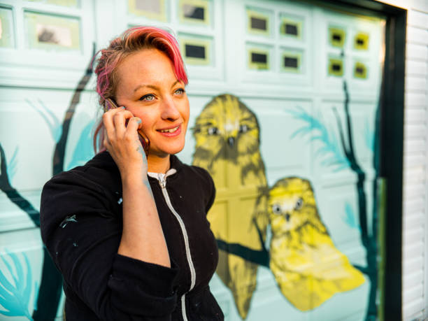 istock Female mural artist at work 1281466619