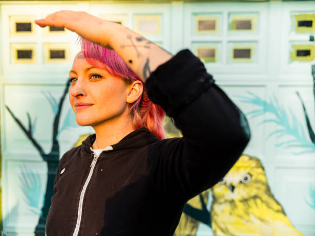 istock Female mural artist at work 1281467328