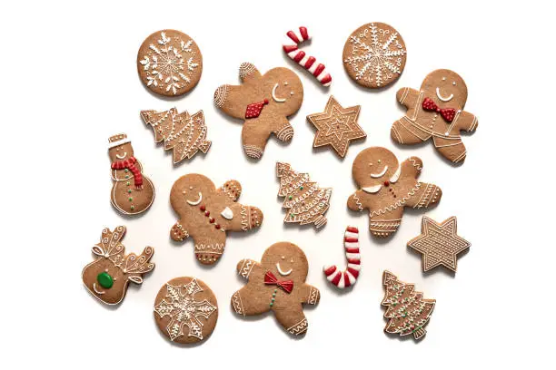 Photo of Christmas gingerbread man cookies, snowman, stars, snowflake, candy cane, reindeer and fir