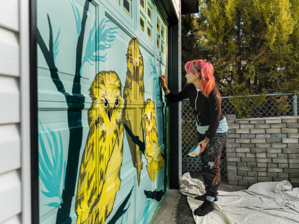 istock Female mural artist at work 1281467493