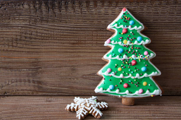 istock Christmas gingerbread on a brown wooden background 1281467557
