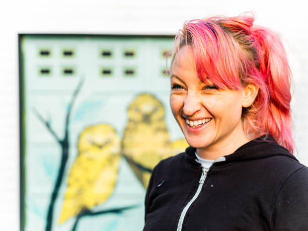 istock Female mural artist at work 1281467611