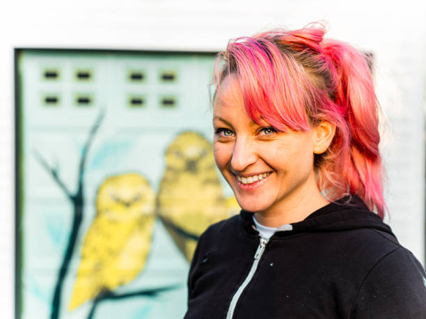 istock Female mural artist at work 1281467617