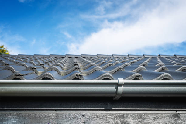 Roof on a house with tiles and a gutter stock photo