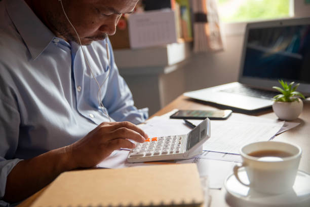 istock Business and Financial Planning Concept. Financial advisor planning and calculate budget, work on laptop. Professional Businessman discusses and analysis annual report at home office. 1281468721