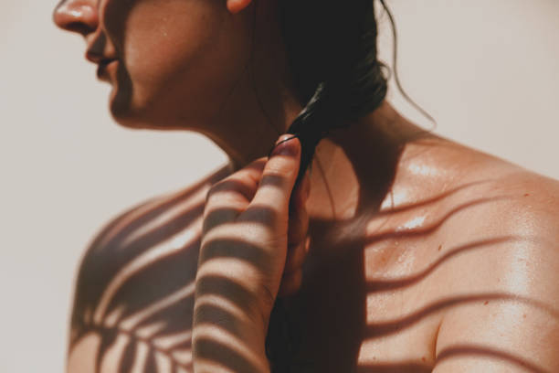 istock Palm Shadows on Woman's Body 1281470434