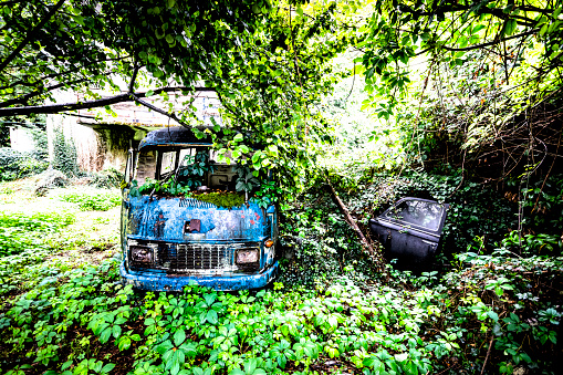 Abandoned vehicle in a French field.  This is on the outskirts of Annecy, France.