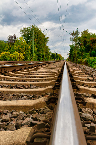 Close-up of railroad tracks leading straight forward to infinity