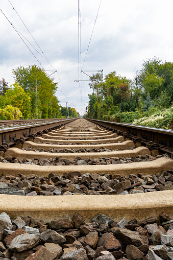 Close-up of railroad tracks leading straight forward to infinity