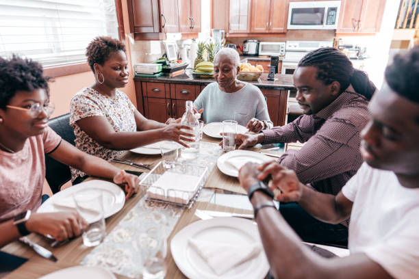 istock Three generation family sitting around the dinner  table 1281475168