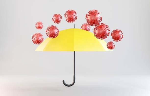 istock Stop Coronavirus. Protection from viruses concept. The yellow umbrella blocks viruses. 1281475183