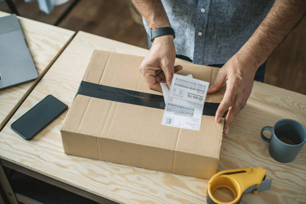 istock Mature man running online store 1281476693