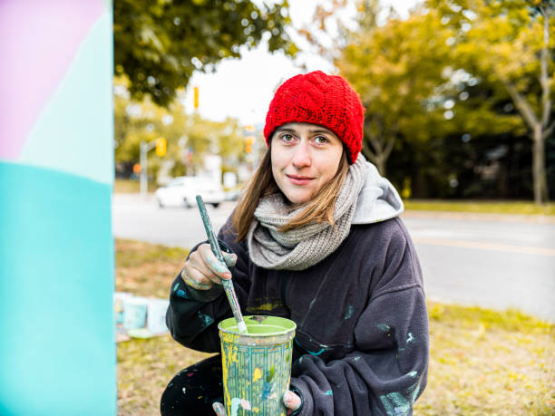 istock Female mural artist at work 1281477356