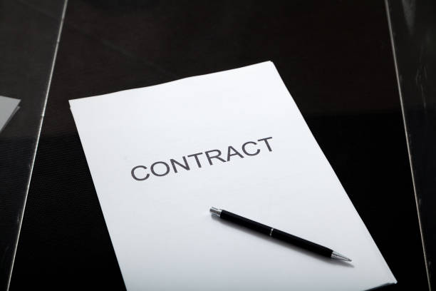 istock Contract and pen lie in transparent box 1281477611