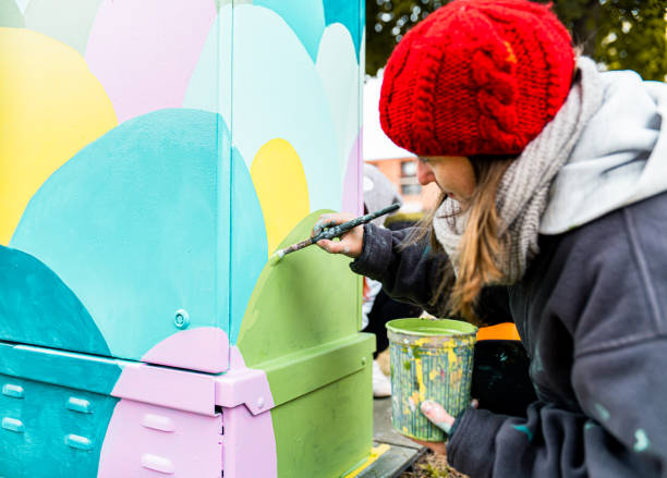 istock Female mural artist at work 1281478186