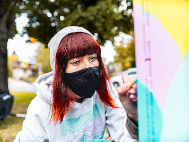 istock Female mural artist at work 1281478288