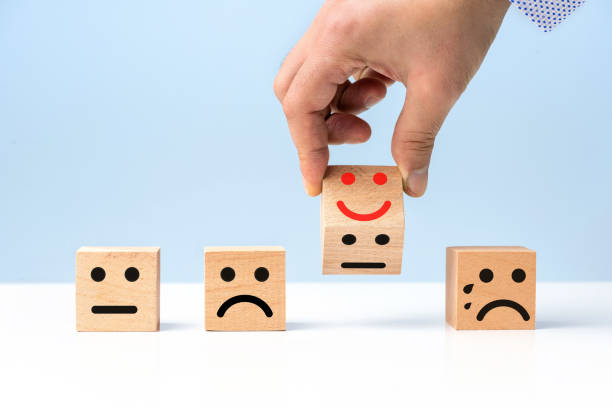 istock Wooden cubes and smiley faces selection concept 1281478358