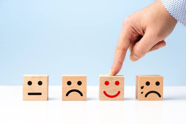 istock Wooden cubes and smiley faces selection concept 1281478386