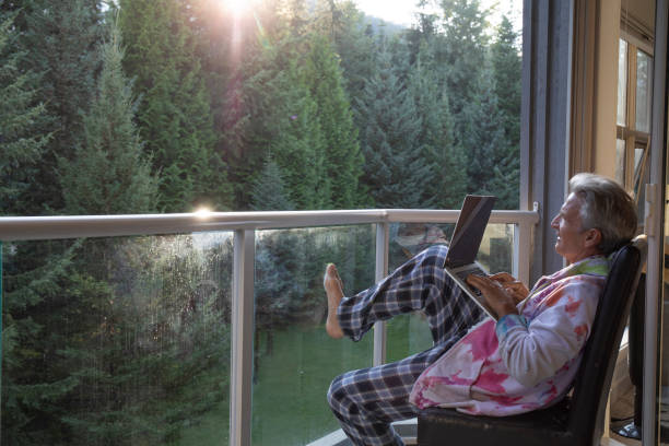 istock Man relaxes on sunlit deck in morning 1281481215