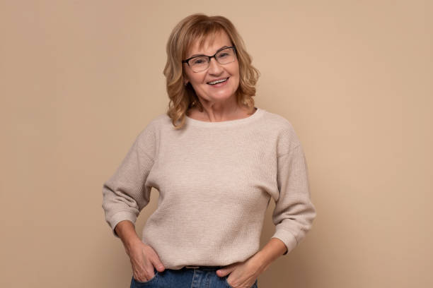 istock Confident mature woman with glasses looking at camera and smiling. 1281481242