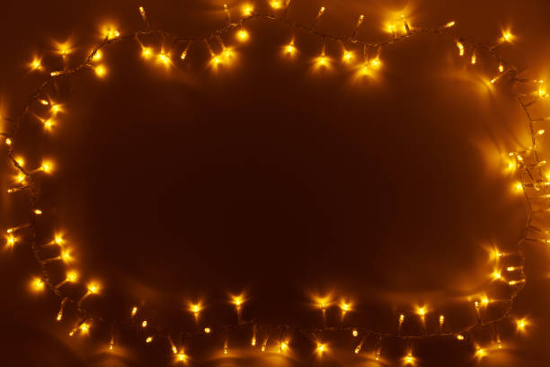 istock flat lay with Christmas lights on dark background 1281481583