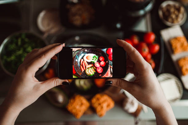 istock Photographing with a smart phone tasty fried egg breakfast 1281481699