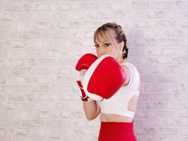 istock Young woman training and exercising with Boxing 1281482679
