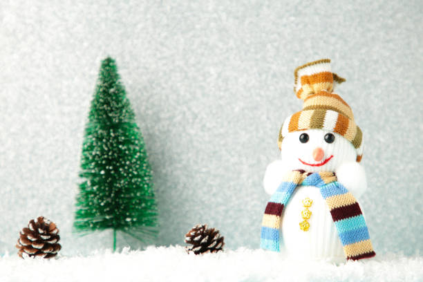 istock Christmas tree with decoration on silver glitter background. 1281483438