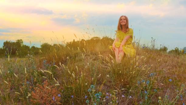 istock Woman resting on the meadow 1281484396