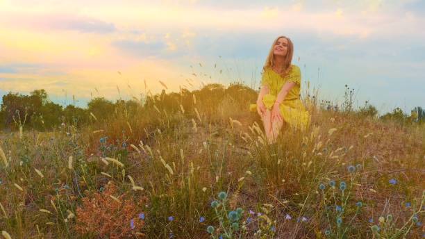 istock Woman resting on the meadow 1281484409