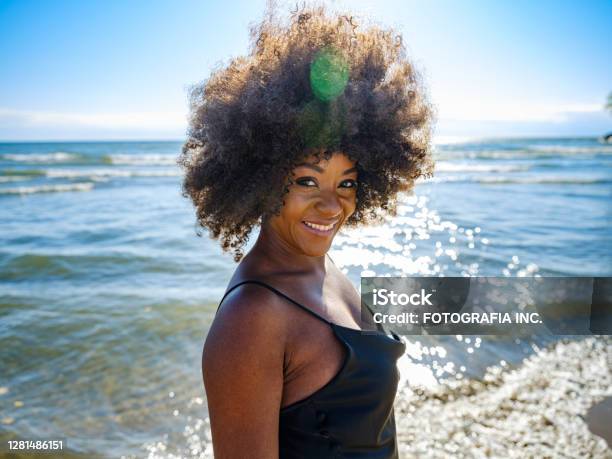 African Woman On A Sandy Beach Stock Photo - Download Image Now - Black Color, One Woman Only, Women