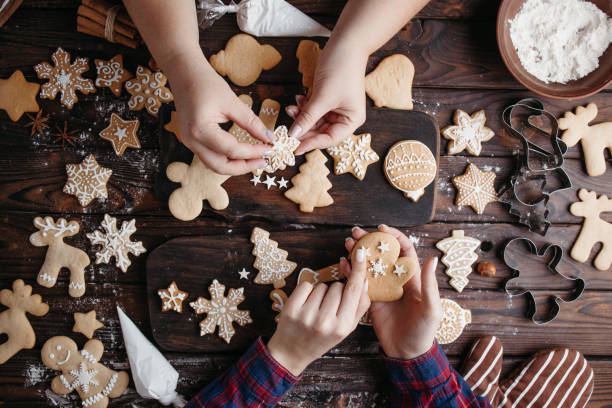 istock Family decorating Christmas gingerbread cookies 1281487672