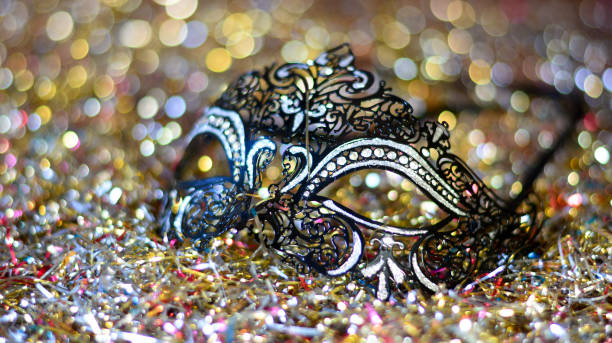 istock the black mask between streamers and confetti 1281488059