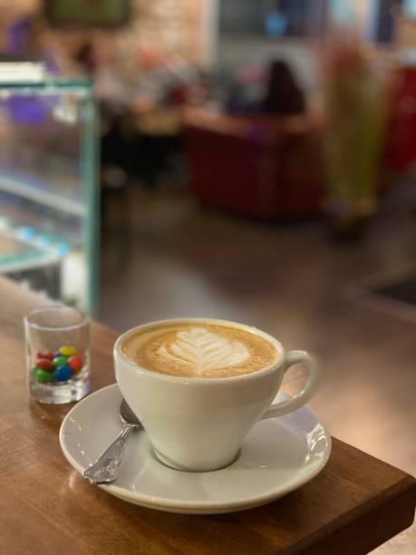istock Coffee, latte art, in cafe, in bar, customers in background 1281489288