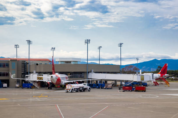 Fuel truck parking near airplane for fueling at the Alfonso Bonilla Aragon airport near Cali in Colombia Palmira, Colombia - October, 2020: Fuel truck parking near airplane for fueling at the Alfonso Bonilla Aragon airport near Cali in Colombia palmira colombia stock pictures, royalty-free photos & images